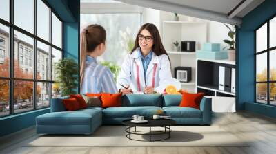 Young woman visiting nutritionist in weight loss clinic Wall mural