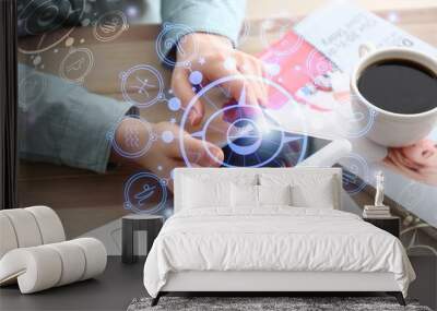 Young woman with mobile phone reading astrological forecast in office Wall mural