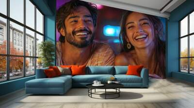 Couple laughing while playing video games Wall mural