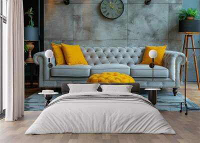 Loft interior design of modern living room, home. Tufted grey sofa with yellow pillows and plaid near tv unit and vibrant yellow pouf in room with concrete wall Wall mural