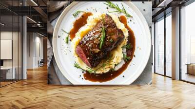 Top View of Roast Beef Covered in Demi Glace Gravy with Mashed Potatoes on a White Plate Wall mural