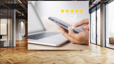 Satisfaction and customer service survey concept, business people using  smartphone. to answer the questionnaire And the satisfaction rating, the satisfaction rating with the  icon 5 stars. Wall mural