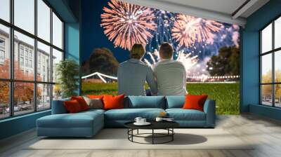 Couple enjoying fireworks at a nighttime festival Wall mural