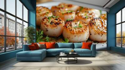 Close-up of perfectly seared scallops garnished with fresh herbs and seasoning on a black plate, showcasing gourmet seafood cuisine. Wall mural