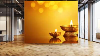 Beautiful brass oil lamp lit with several diyas, on a radiant orange-to-golden yellow gradient background with soft light effects. Copy space, Indian traditional festival happy Diwali background Wall mural