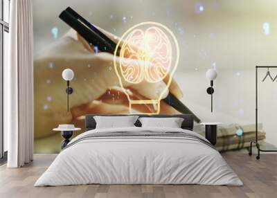 Creative idea concept with light bulb and human brain illustration and with woman hand writing in notebook on background. Neural networks and machine learning concept. Multiexposure Wall mural