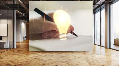 Creative idea concept with light bulb illustration and hand writing in notebook on background. Multiexposure Wall mural