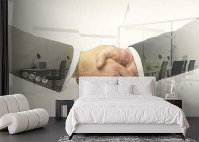 Double exposure handshake of two businessmen on modern furnished office interior background, collaboration and coworking concept Wall mural