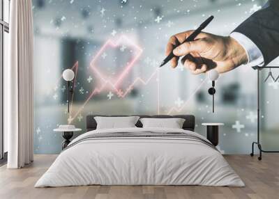 Double exposure of male hand with pen working with abstract virtual heart rate hologram on blurred interior background. Healthcare technolody concept Wall mural