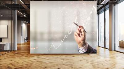 Double exposure of man hand with pen working with abstract creative financial chart and world map on blurred office background, research and strategy concept Wall mural