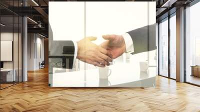 Handshake of two businessmen on conference room interior background, deal and partnership concept. Multiexposure Wall mural