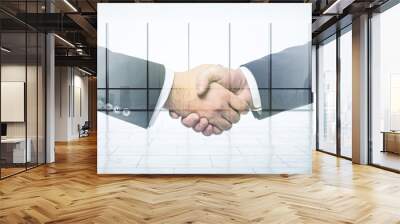 Handshake of two businessmen on empty office interior background, deal and partnership concept. Multiexposure Wall mural