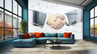 Handshake of two businessmen on modern furnished office interior background, deal and partnership concept. Multiexposure Wall mural