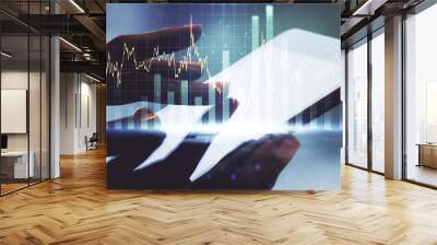 Multi exposure of abstract creative financial graph with finger presses on a digital tablet on background, forex and investment concept Wall mural