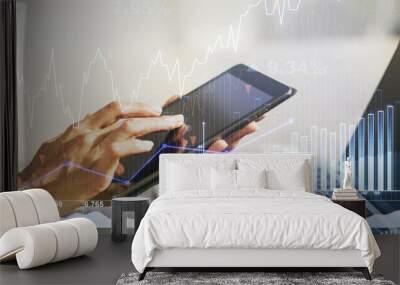 Multi exposure of abstract financial diagram and hand working with a digital tablet on background, banking and accounting concept Wall mural