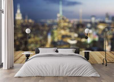 Wooden table top with beautiful blurry skyline at night on background, mockup Wall mural