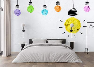 Colorful paper light bulb on wrinkled paper texture with copy space Wall mural