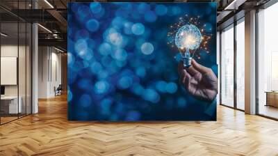 Businessman holding half of virtual lightbulb and brain on blue dark background , Smart thinking idea and inspiration innovation background Wall mural