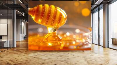 A vivid close up image of honey trickling from a dipper Wall mural