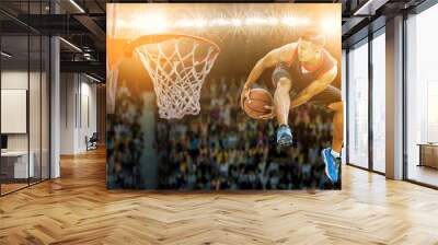 basketball player jumping and dribbling ball in the air,Action in the stadium during match Wall mural