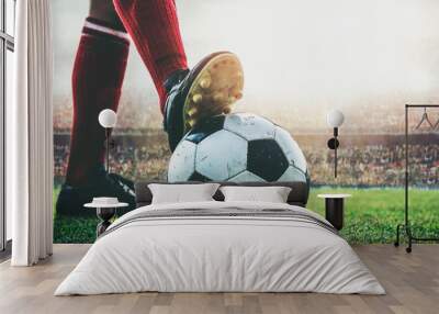 feet of soccer player tread on soccer ball for kick-off in the stadium Wall mural