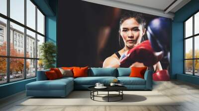 two asian women doing practice boxing together at the health club Wall mural