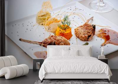 Crispy deep fried lamb chops with almond crust, gravy sauce and vegetable puree Wall mural