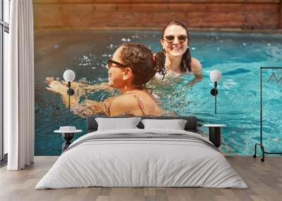 1407911 Two woman swimming in pool Wall mural