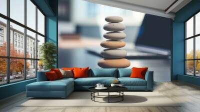 Zen stones on the desk with laptop in office Wall mural