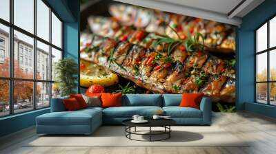 Grilled sardines on a plate with lemon slices Wall mural