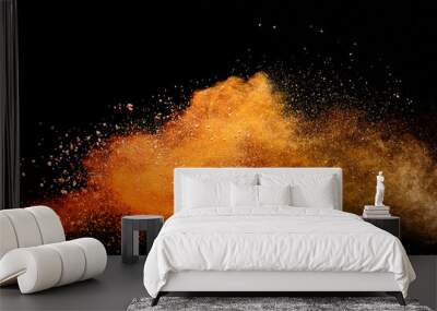 Abstract orange powder explosion isolated on black background. Wall mural