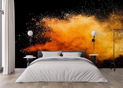 Abstract orange powder explosion isolated on black background. Wall mural