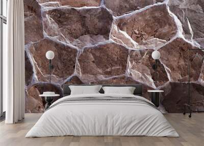 Detail of a stone wall with different size of rocks. Wall mural