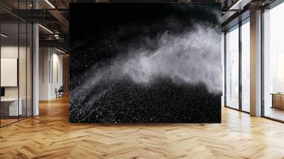 Freeze motion of white powder explosions isolated on black background Wall mural