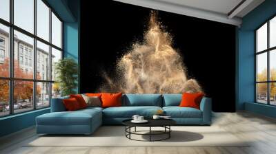 Gold sand explosion isolated on black background. Abstract sand cloud. Wall mural