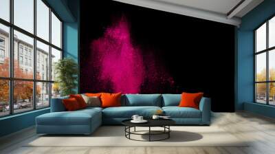 Pink powder explosion on black background. Paint Holi. Wall mural