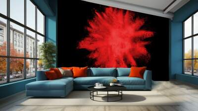 Red powder explosion isolated on black background. Wall mural