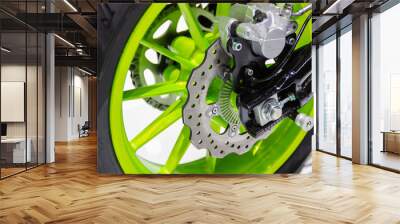 Detail Motorcycle wheel in black and green with ABS brakes part of the motorcycle. Wall mural