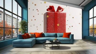 Red gift box with gold ribbon and stars on white background. Wall mural