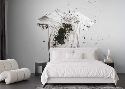 White T-shirt with splattered dirt on white background . Wall mural