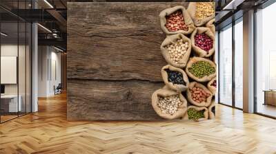 Legumes seed in sack on wooden background, top view. Protein from bean is best nutrition for vegan food Wall mural