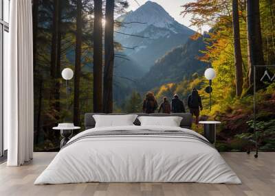 Back view of a group hiker adventure through a forest path, framed by the stunning view of a mountain. Wall mural