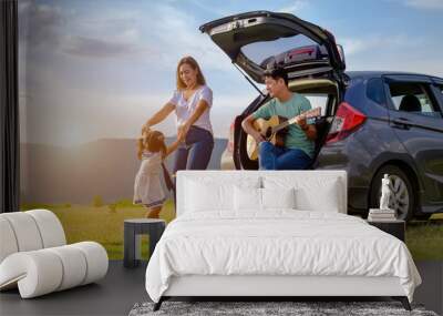 Asian family.happy little girl with family sitting in the car.Car insurance concept	 Wall mural