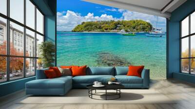 Boats anchoring near little island off coast of Saint Vincent island, Caribbean Sea region of Lesser Antilles Wall mural