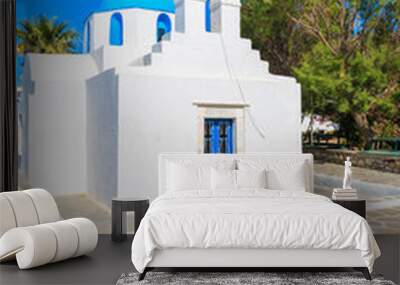 Square with typical white church with blue dome and Greek flag on Paros island, Cyclades, Greece Wall mural