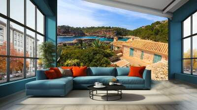 stone houses in cala s'almunia bay, majorca island, spain Wall mural