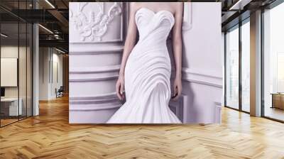 Elegant woman princess wearing a beautiful high fashion haute couture wedding dress against baroque design studio. Wall mural