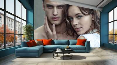 Intimate male and female fashion model couple staring at the camera and looking sexy. Passionate beauty portrait. Wall mural