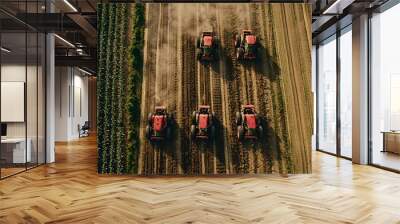 Aerial View of Multiple Tractors Working on a Large Industrial Farm Wall mural