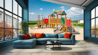 Colorful outdoor children playground in sunny day blue sky background. Kid learning and development concept. Wall mural